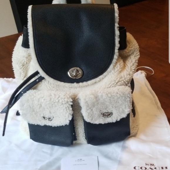 Coach Handbags - Like New COACH Turnlock Tie Ruckshack in Shearling